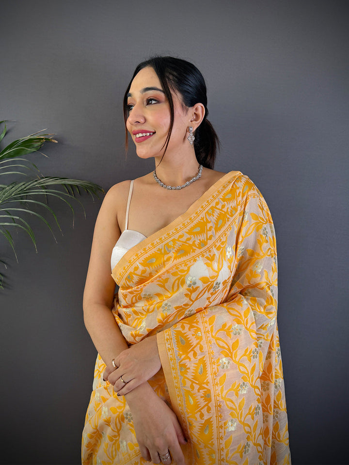 Yellow Soft Silk Saree with White Floral Weaving & Tassel Pallu