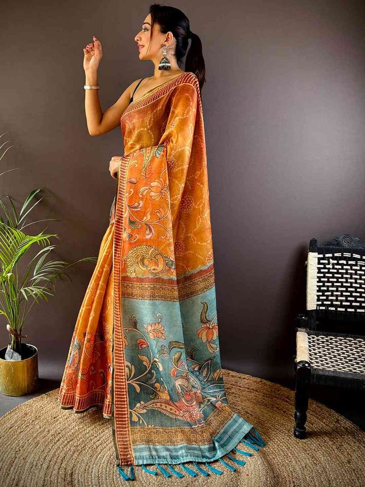 Rust Orange Soft Silk Saree with Kalamkari-Style Printed Pallu & Teal Tassels
