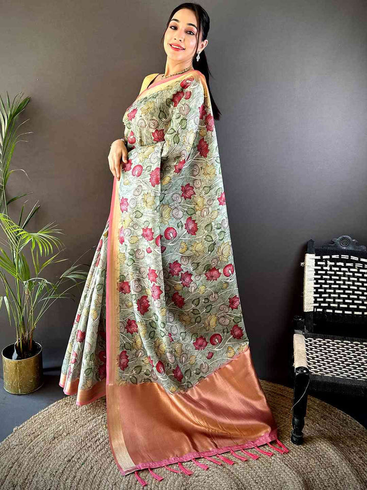 Pastel Green Floral Soft Silk Saree with Peach Zari Border