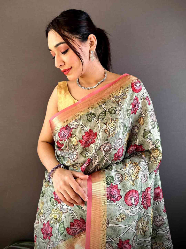 Pastel Green Floral Soft Silk Saree with Peach Zari Border