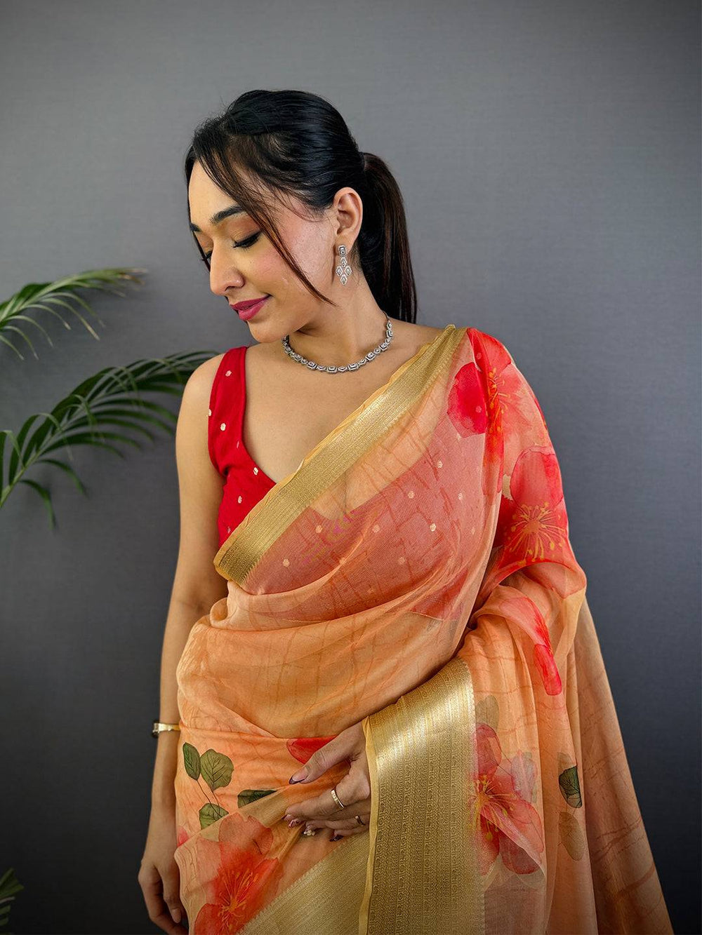 Yellow Organza Saree with Bold Red Floral Print & Golden Zari Border