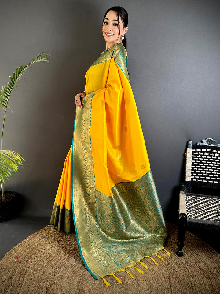 Yellow Soft Silk Saree with Teal Blue Golden Zari Border