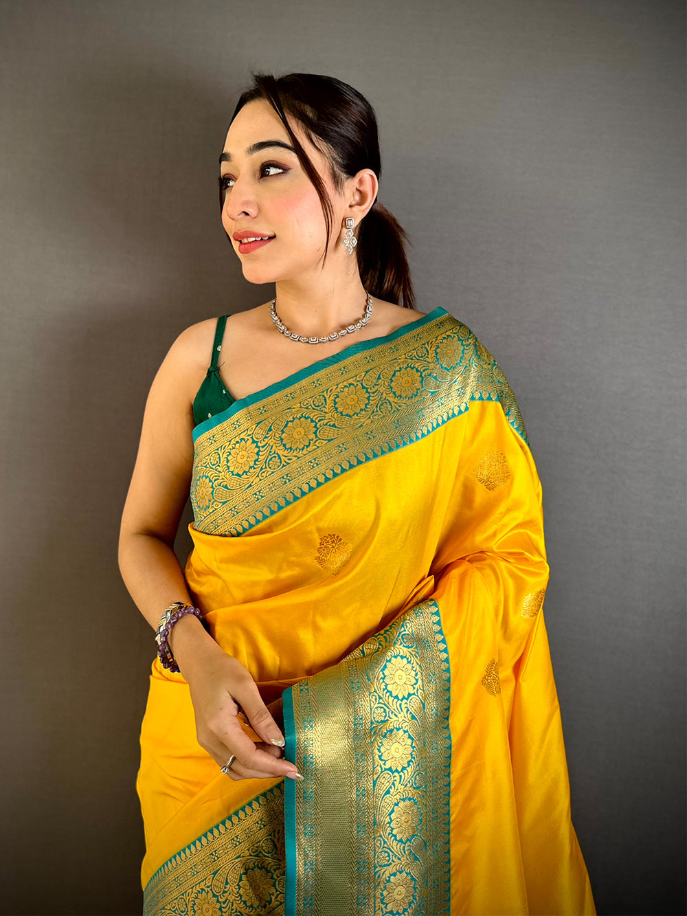 Yellow Soft Silk Saree with Teal Blue Golden Zari Border