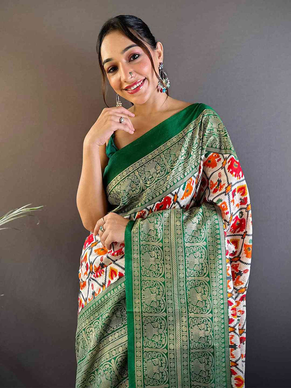 Green Patola Print Soft Silk Saree with Contrast Red Border