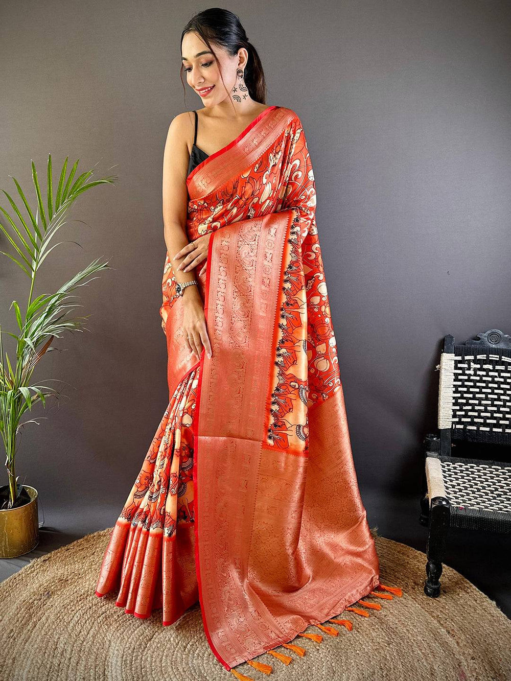 Orange Soft Silk Saree with Artistic Print & Rich Zari Border