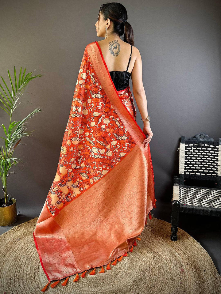 Orange Soft Silk Saree with Artistic Print & Rich Zari Border