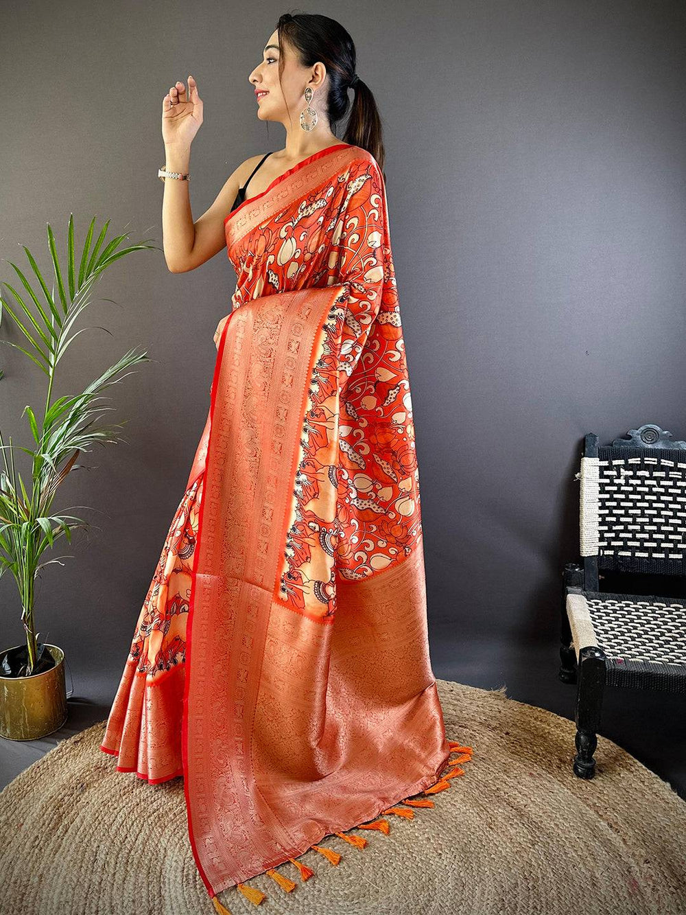 Orange Soft Silk Saree with Artistic Print & Rich Zari Border