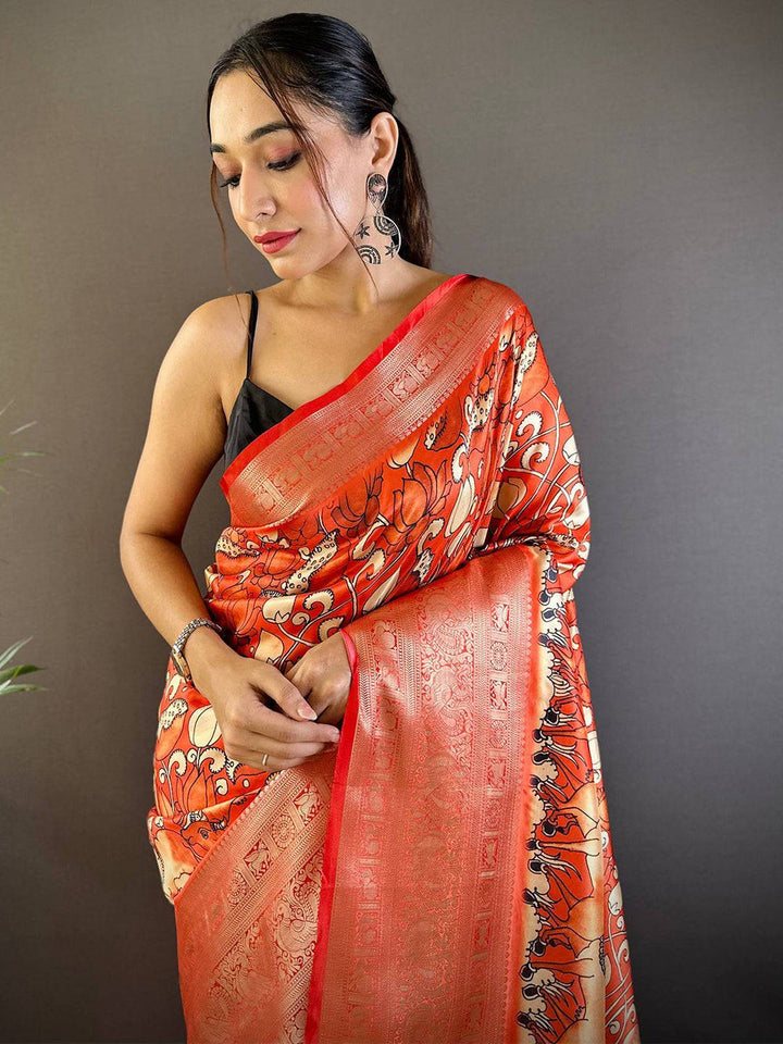 Orange Soft Silk Saree with Artistic Print & Rich Zari Border