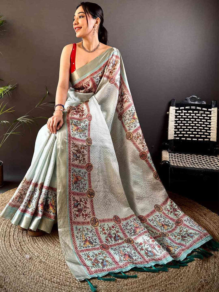 Off White Soft Silk Saree with Traditional Kalamkari Print & Contrast Teal Tassels