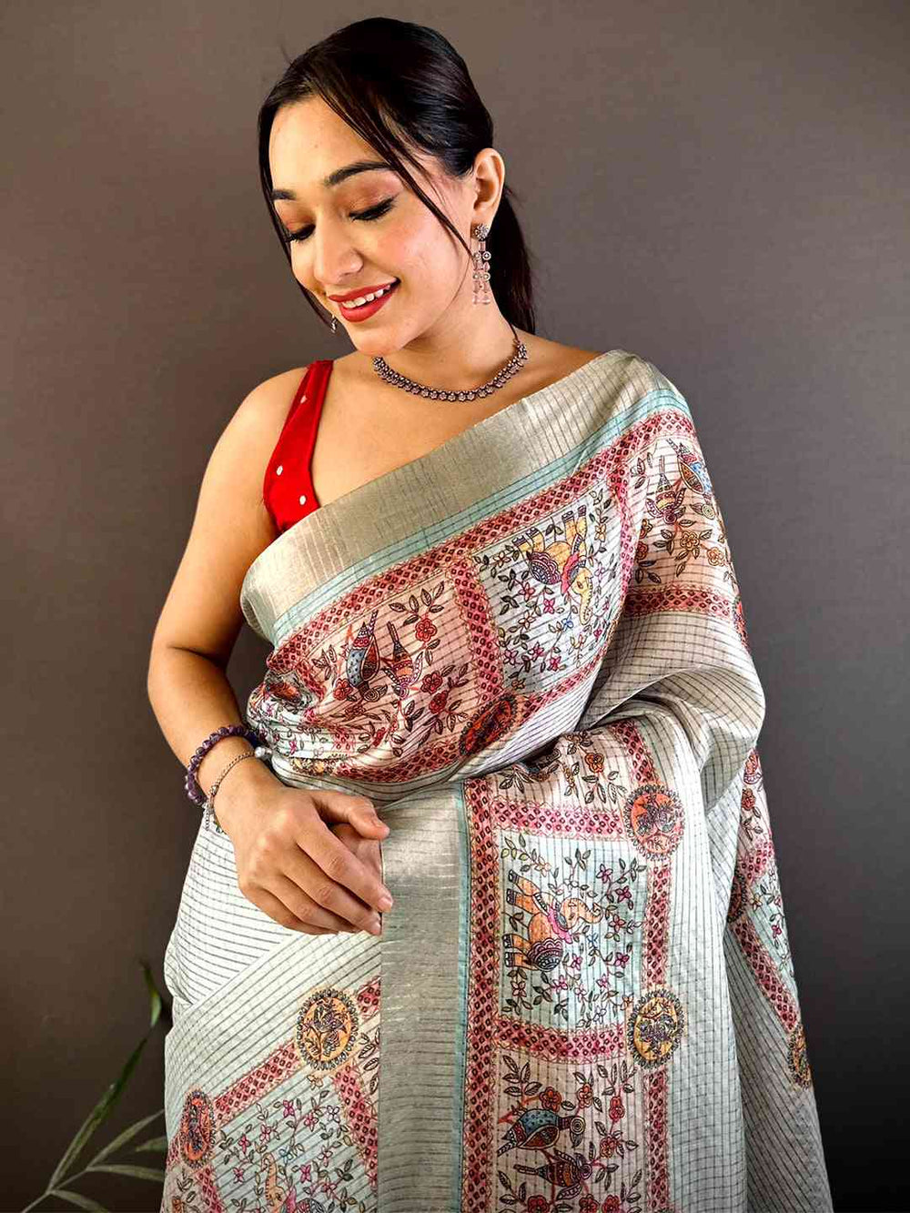 Off White Soft Silk Saree with Traditional Kalamkari Print & Contrast Teal Tassels