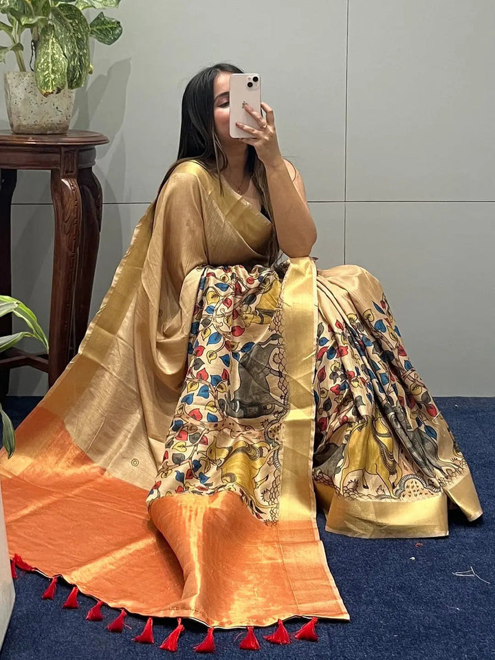 Golden Soft Silk Saree with Multicolor Madhubani Print & Orange Tassel Border