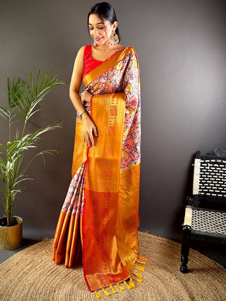 Orange Soft Silk Saree with Floral Print & Red Zari Border