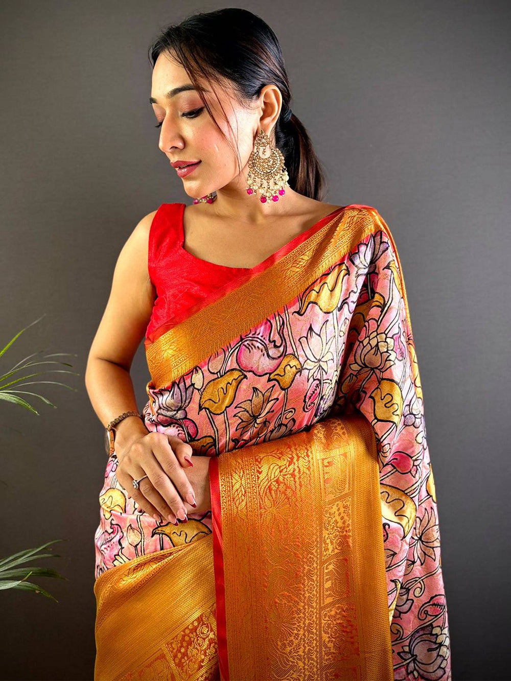Orange Soft Silk Saree with Floral Print & Red Zari Border
