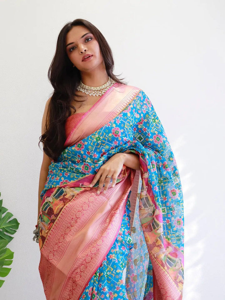Blue Patola Print Soft Silk Saree with Peach Zari Border & Designer Pallu