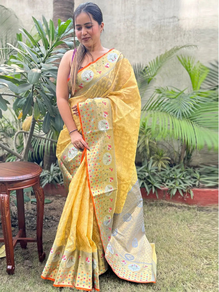 Yellow Banarasi Soft Silk Saree with Silver Zari Weaving & Multicolor Motifs