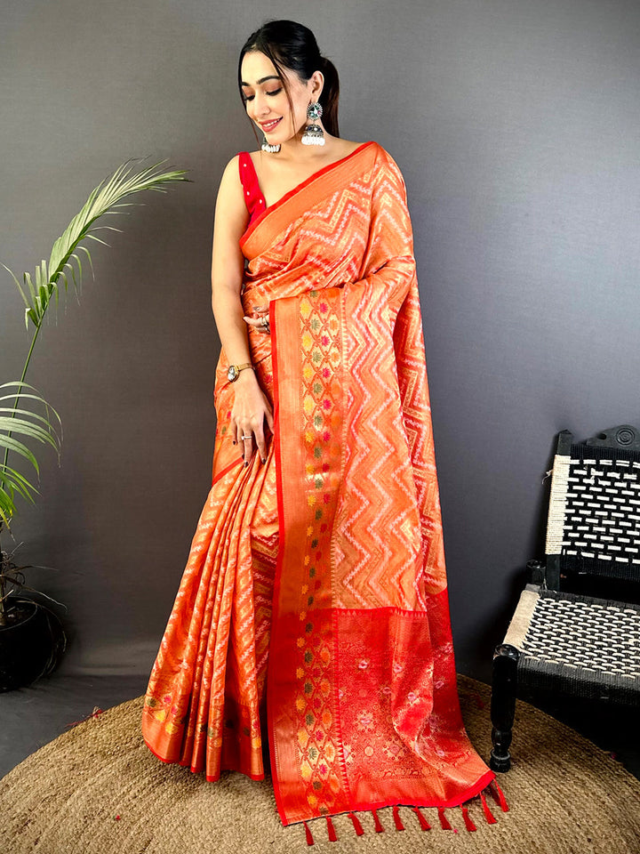 Orange Soft Silk Saree with Zigzag Weave & Red Zari Border