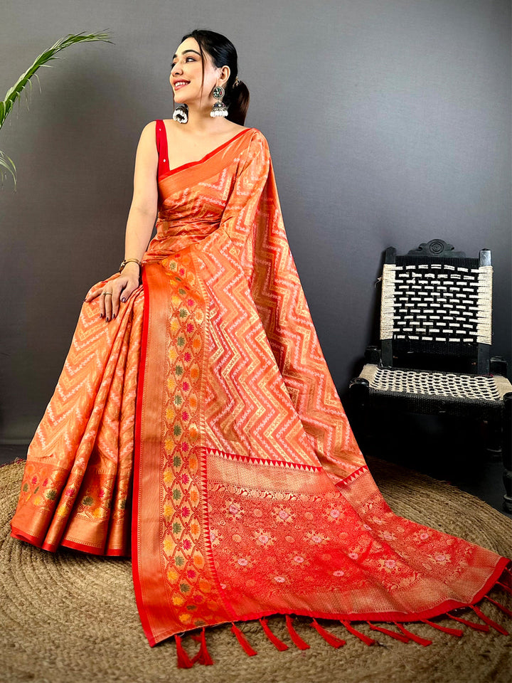 Orange Soft Silk Saree with Zigzag Weave & Red Zari Border
