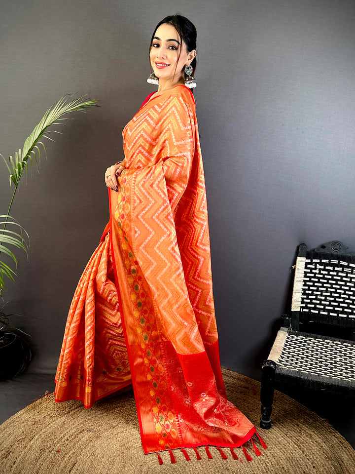 Orange Soft Silk Saree with Zigzag Weave & Red Zari Border