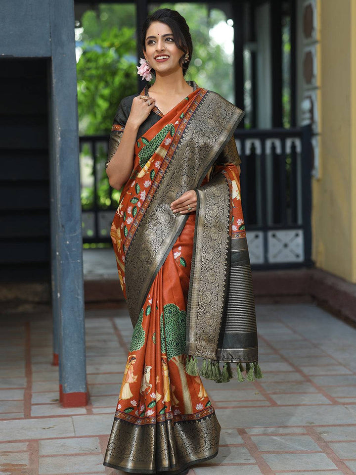 Rust Printed Kanjivaram Silk Saree with Black Zari Border & Traditional Motifs