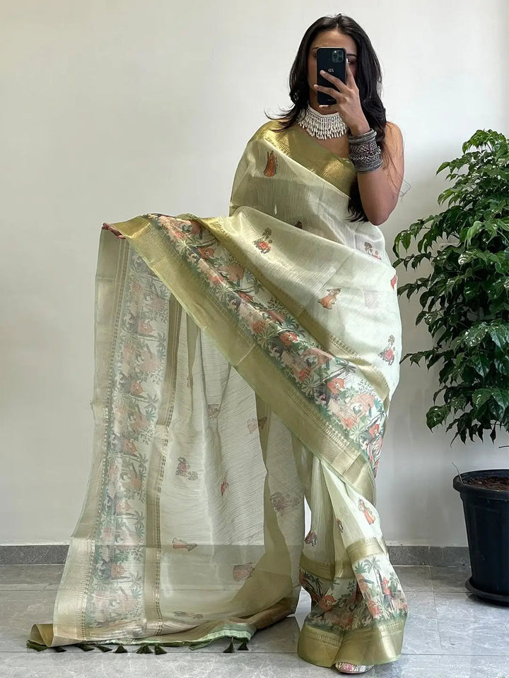 Light Green Soft Silk Saree with Traditional Village Print & Gold Zari Border