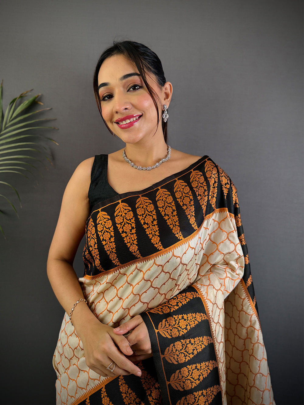 Cream & Black Soft Silk Saree with Orange Floral Weaving and Geometric Print