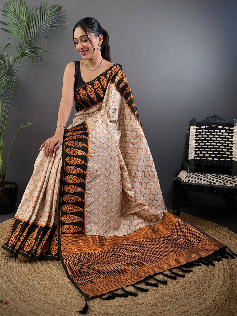 Cream & Black Soft Silk Saree with Orange Floral Weaving and Geometric Print