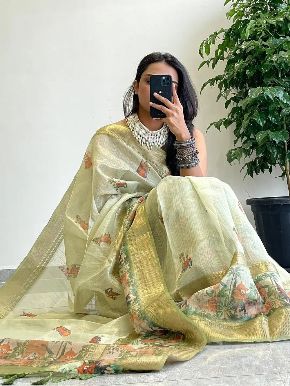 Light Green Soft Silk Saree with Traditional Village Print & Gold Zari Border