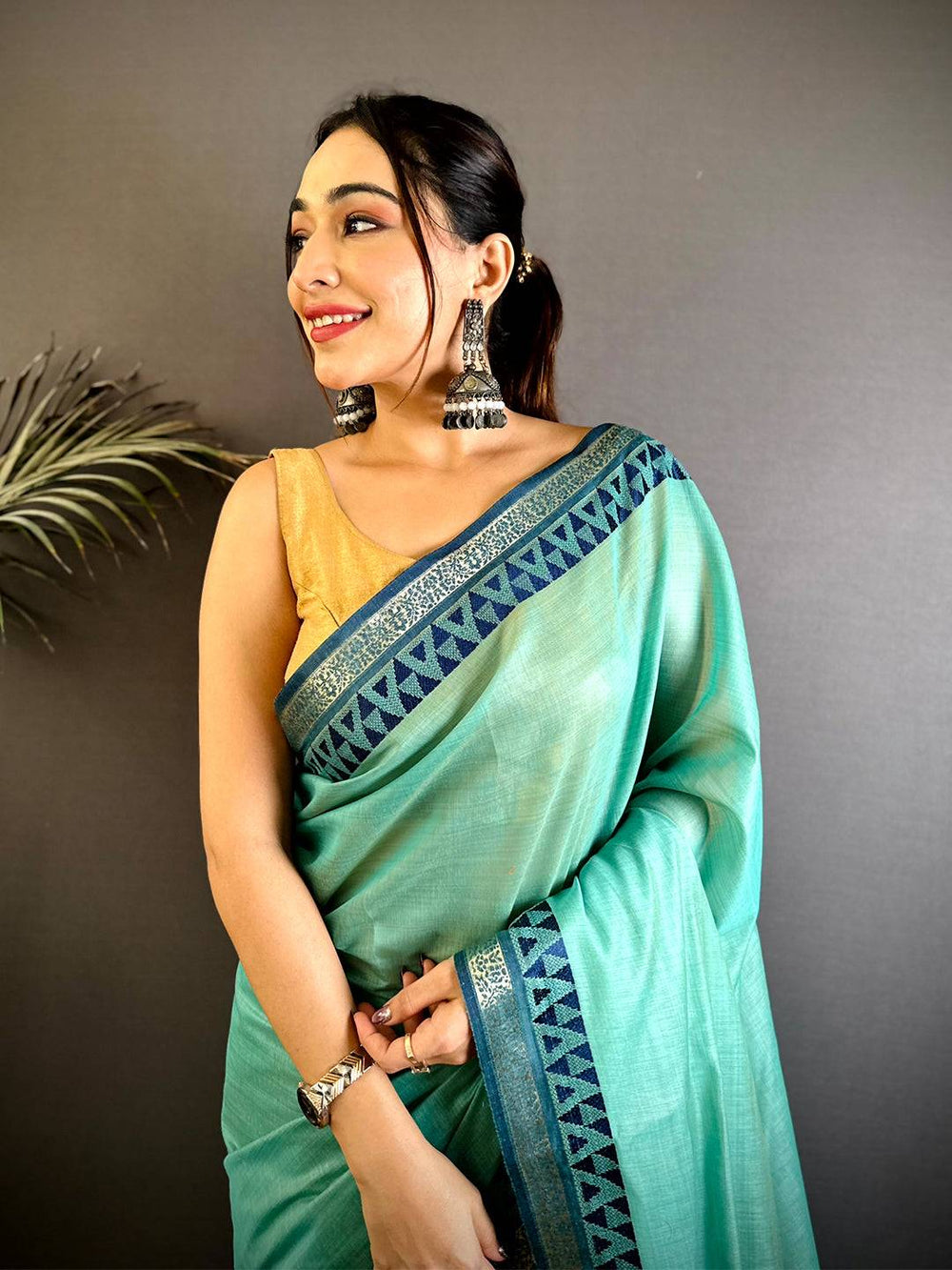Mint Green Linen Soft Silk Saree with Blue Geometric Border & Tassels