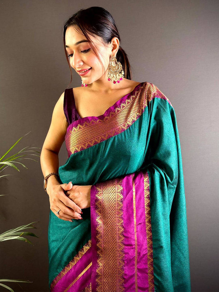Emerald Green Soft Silk Saree with Pink–Gold Zari Border & Striped Pallu