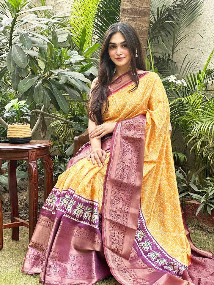 Yellow Patola Print Silk Saree with Maroon Zari Border & Traditional Motif Pallu