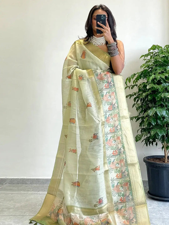 Light Green Soft Silk Saree with Traditional Village Print & Gold Zari Border
