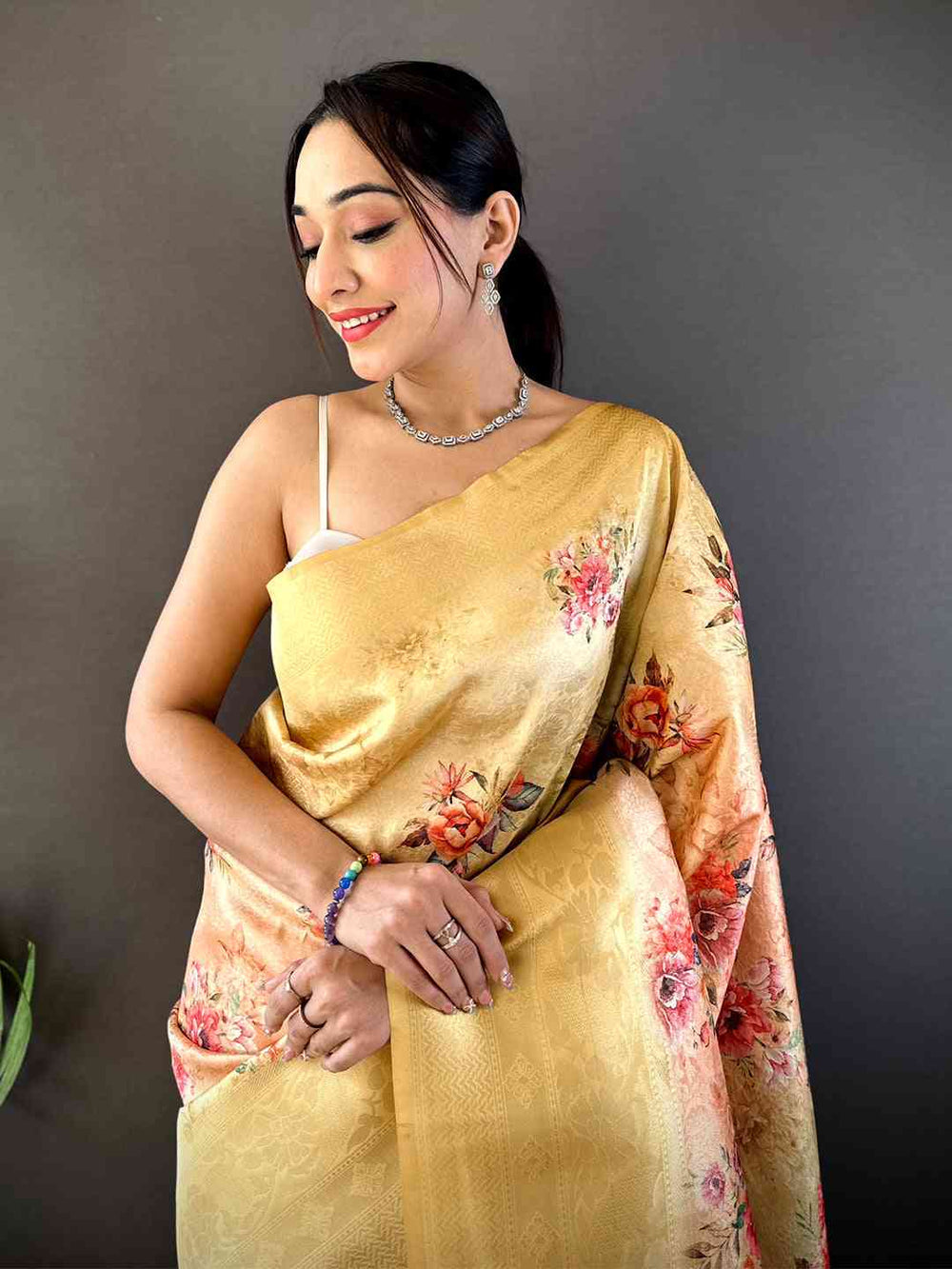Pastel Yellow Soft Silk Saree with Subtle Floral Print & Elegant Tassel Pallu