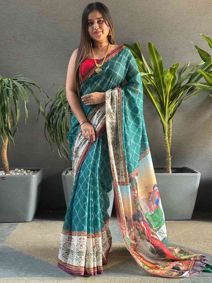 Teal Printed Silk Saree with Artistic Village Scene Pallu & Contrast Red Blouse Look
