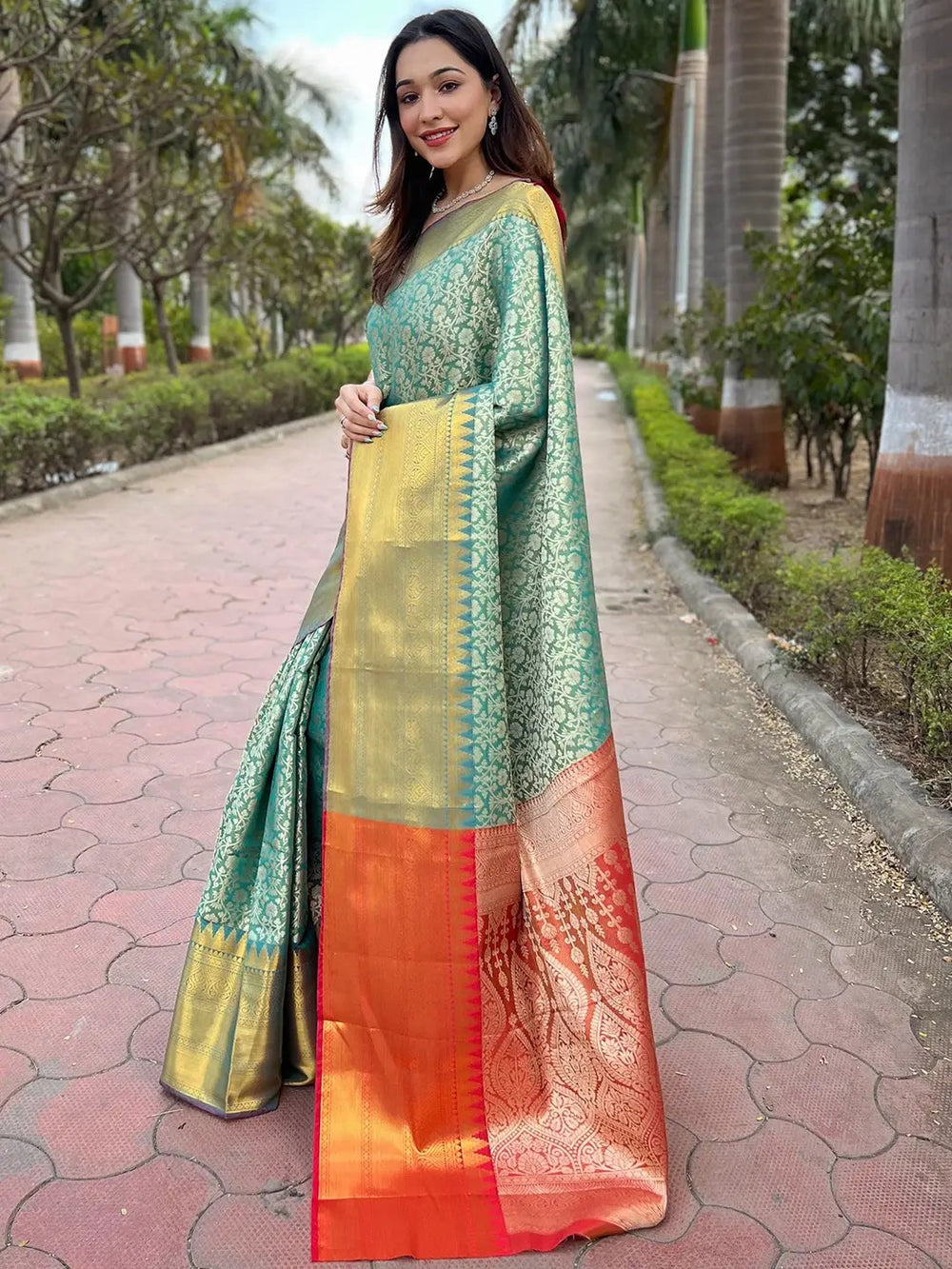 Green Banarasi Silk Saree with Gold Zari Weaving & Contrast Orange Border
