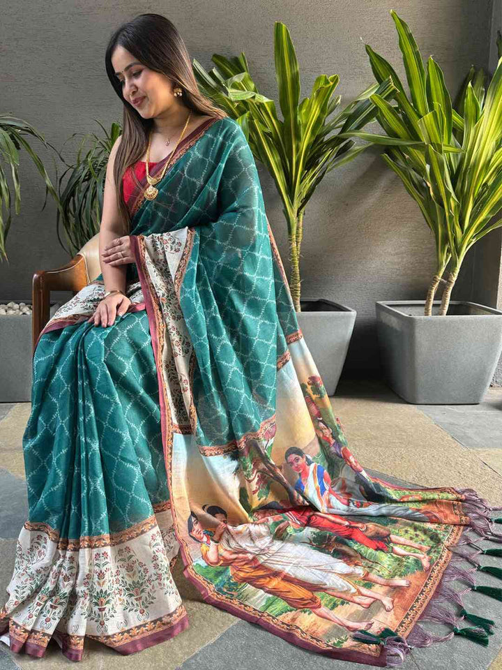 Teal Printed Silk Saree with Artistic Village Scene Pallu & Contrast Red Blouse Look