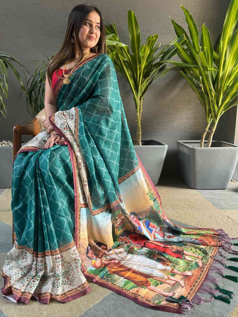 Teal Printed Silk Saree with Artistic Village Scene Pallu & Contrast Red Blouse Look