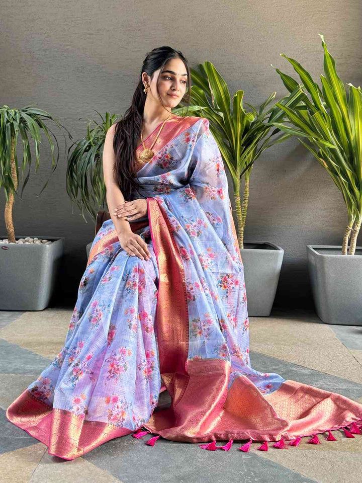 Pastel Blue Floral Silk Saree with Pink Gold Zari Border & Tassel Pallu
