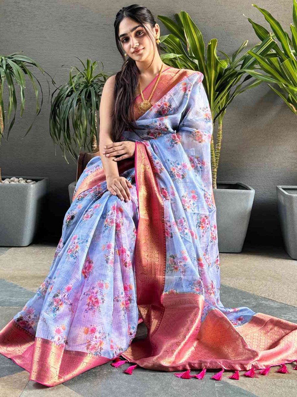 Pastel Blue Floral Silk Saree with Pink Gold Zari Border & Tassel Pallu