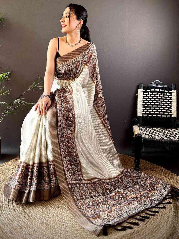 Cream & Brown Linen Silk Saree with Traditional Printed Border & Tassel Pallu
