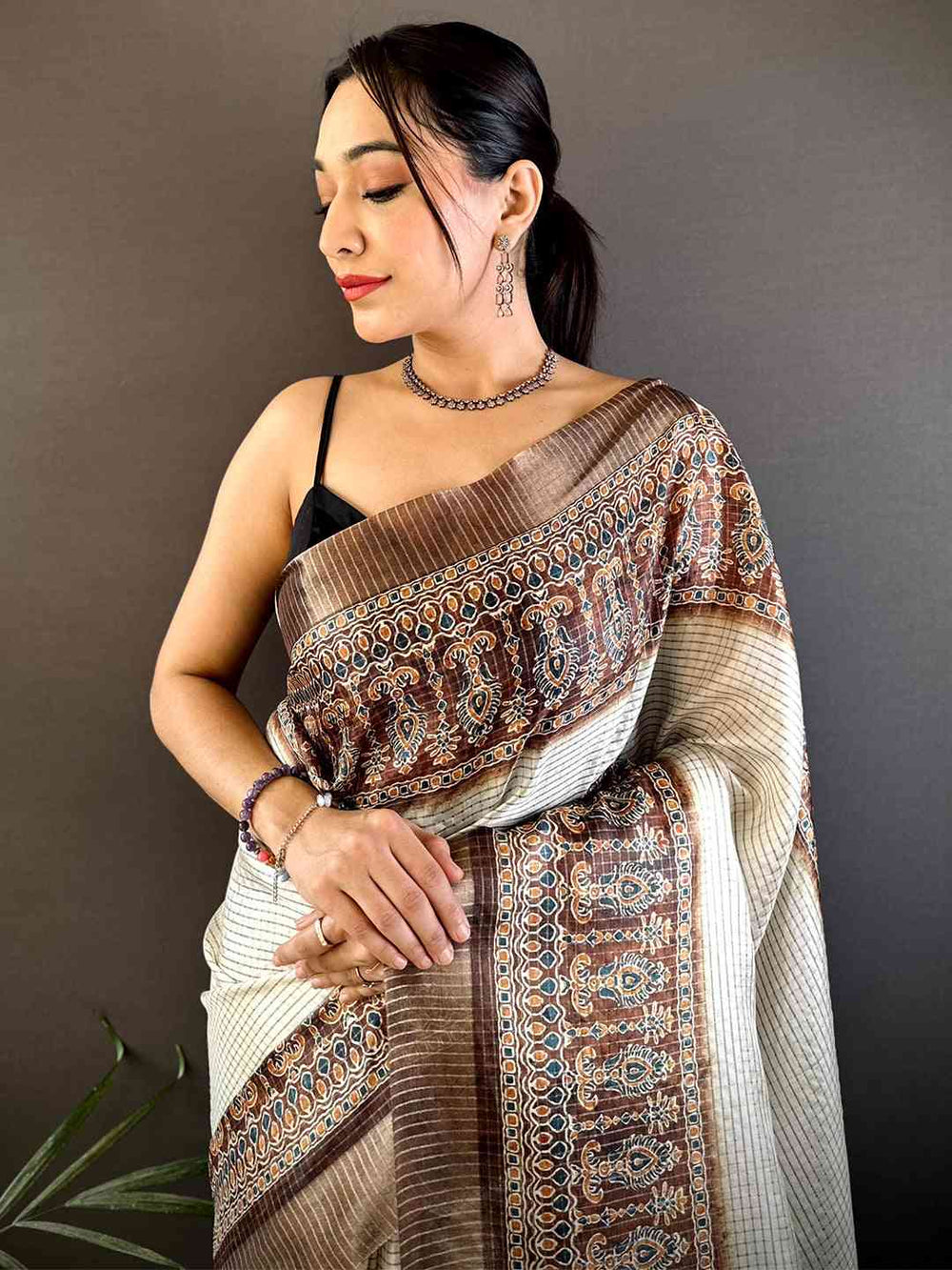 Cream & Brown Linen Silk Saree with Traditional Printed Border & Tassel Pallu