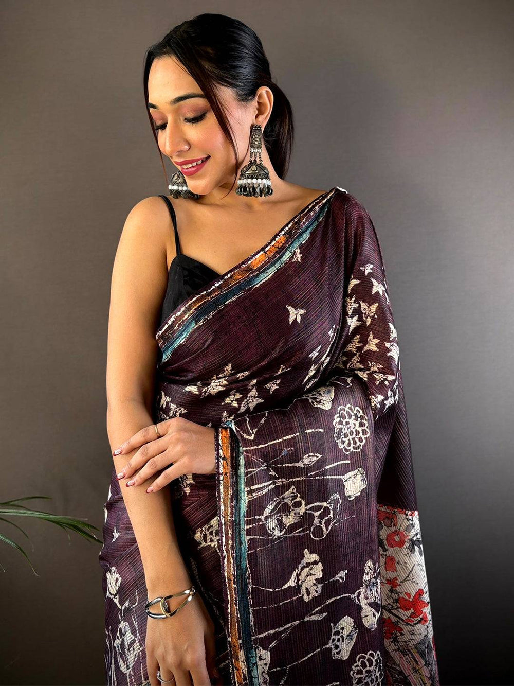 Maroon Linen Silk Saree with Artistic Floral Print & Tassel Pallu