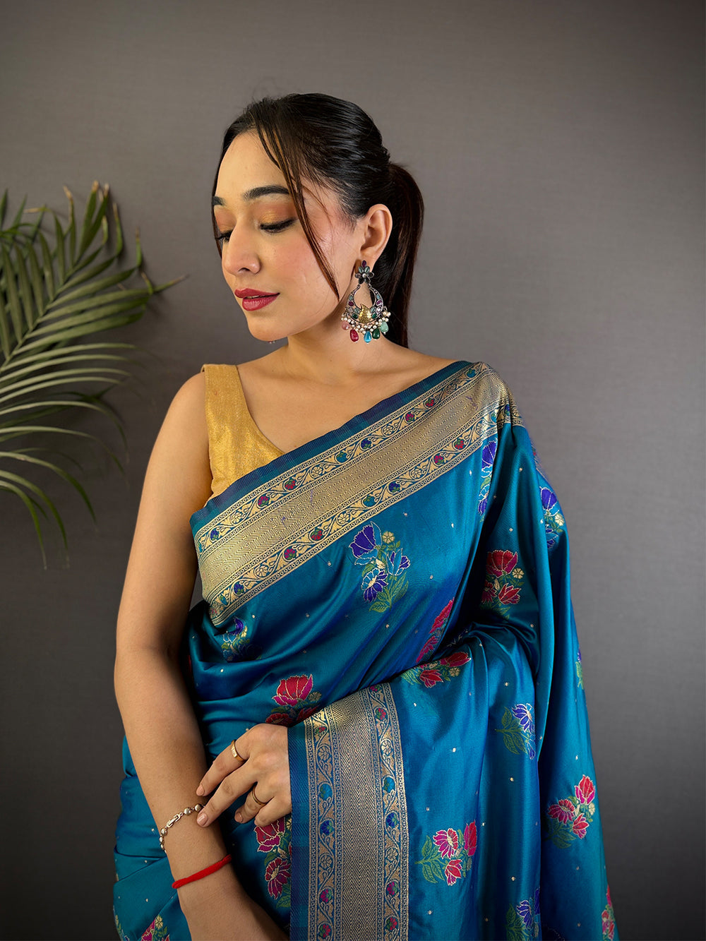 Teal Blue Banarasi Silk Saree with Zari Border & Multi Color Butta Weaving