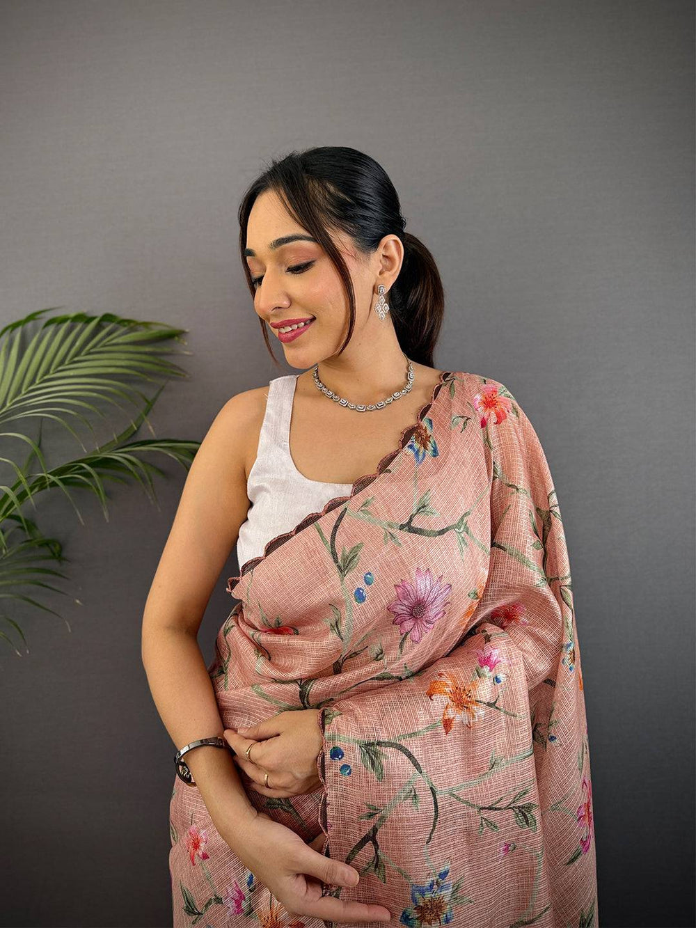 Peach Printed Silk Saree with Soft Floral Design & Elegant Woven Texture