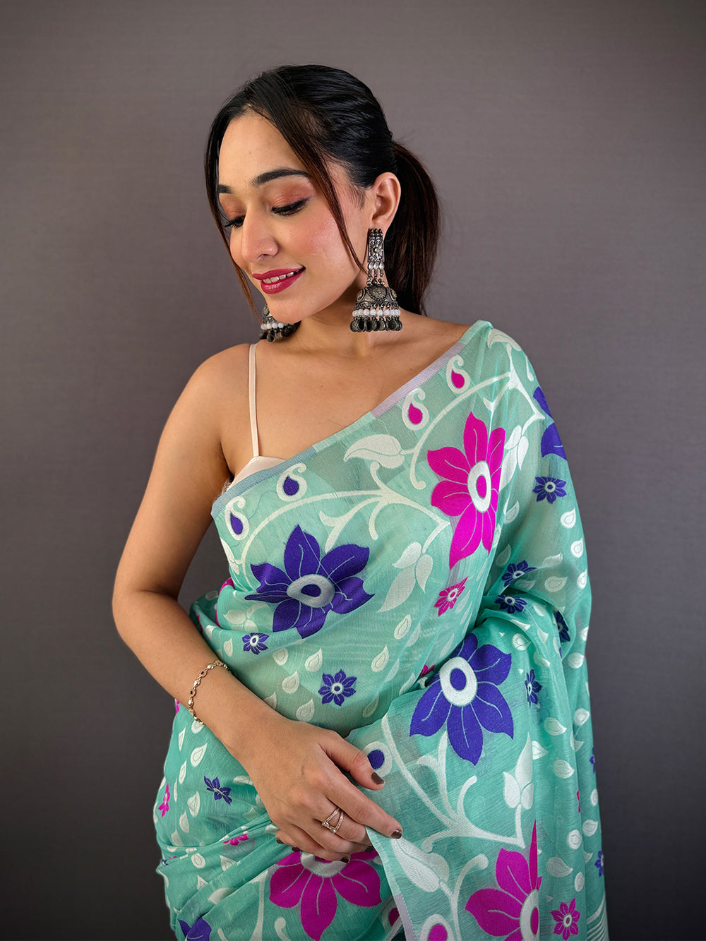 Mint Green Linen Cotton Saree with Bold Floral Print & Contrast Tassel Pallu