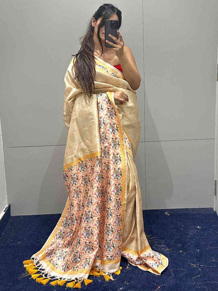 Ivory & Pastel Pink Banarasi Silk Saree with Floral Woven Pallu & Yellow Tassels