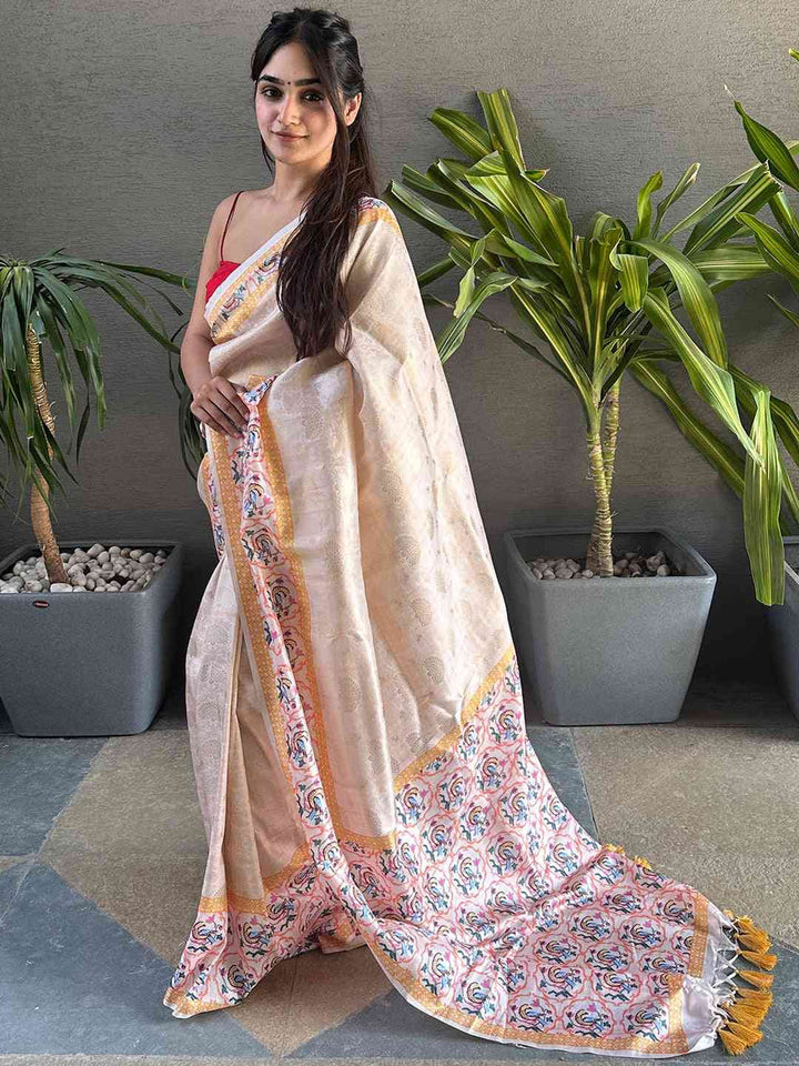 Ivory & Pastel Pink Banarasi Silk Saree with Floral Woven Pallu & Yellow Tassels