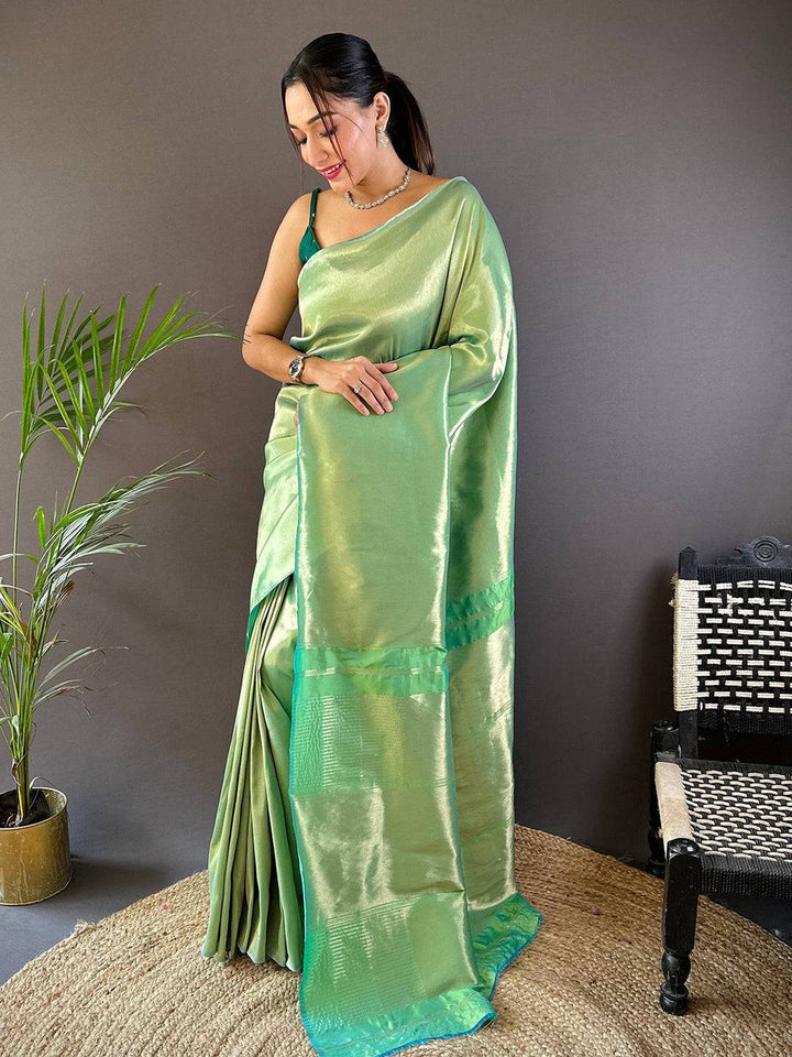 Pastel Green Soft Silk Saree with Glossy Finish & Contrast Border