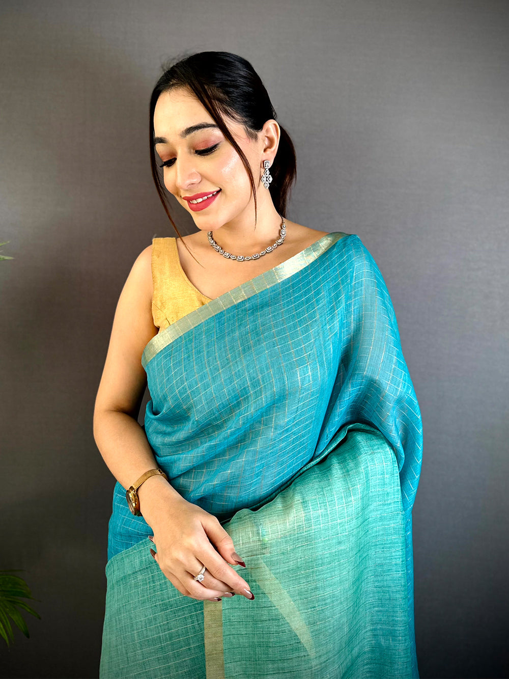 Teal Handwoven Linen Saree with Golden Border & Tassel Pallu
