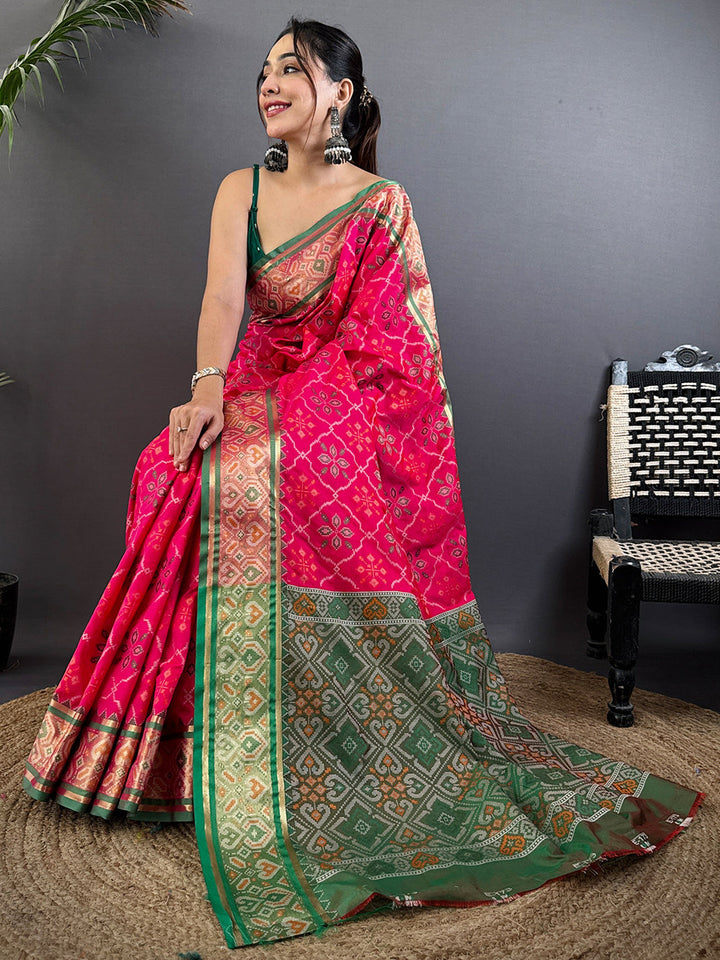 Rani Pink Patola Banarasi Silk Saree with Green Contrast Border & Zari Weaving
