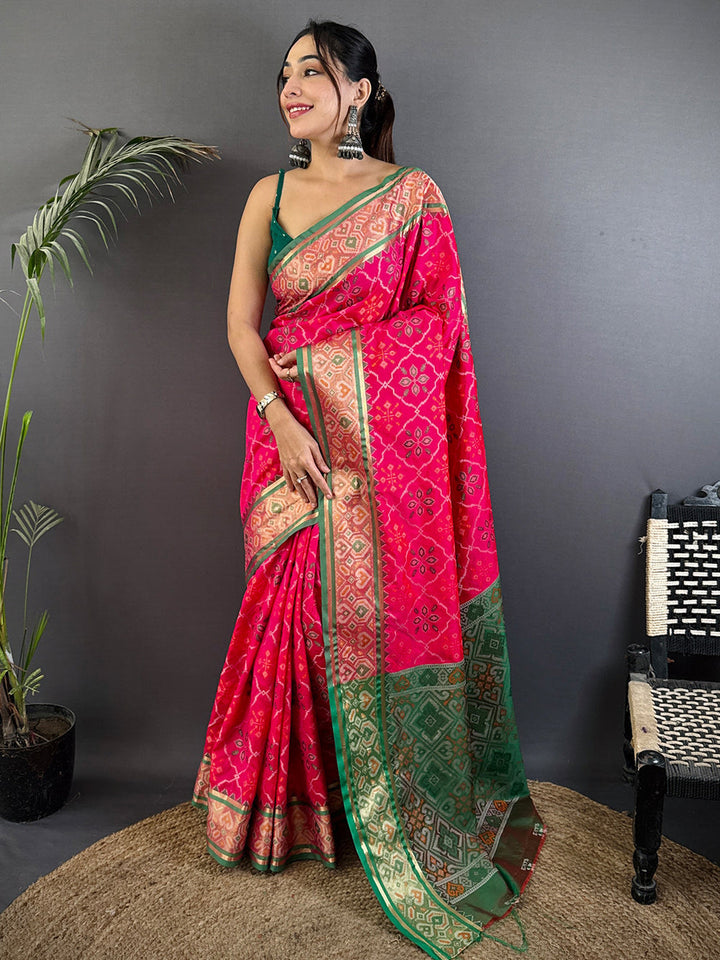 Rani Pink Patola Banarasi Silk Saree with Green Contrast Border & Zari Weaving